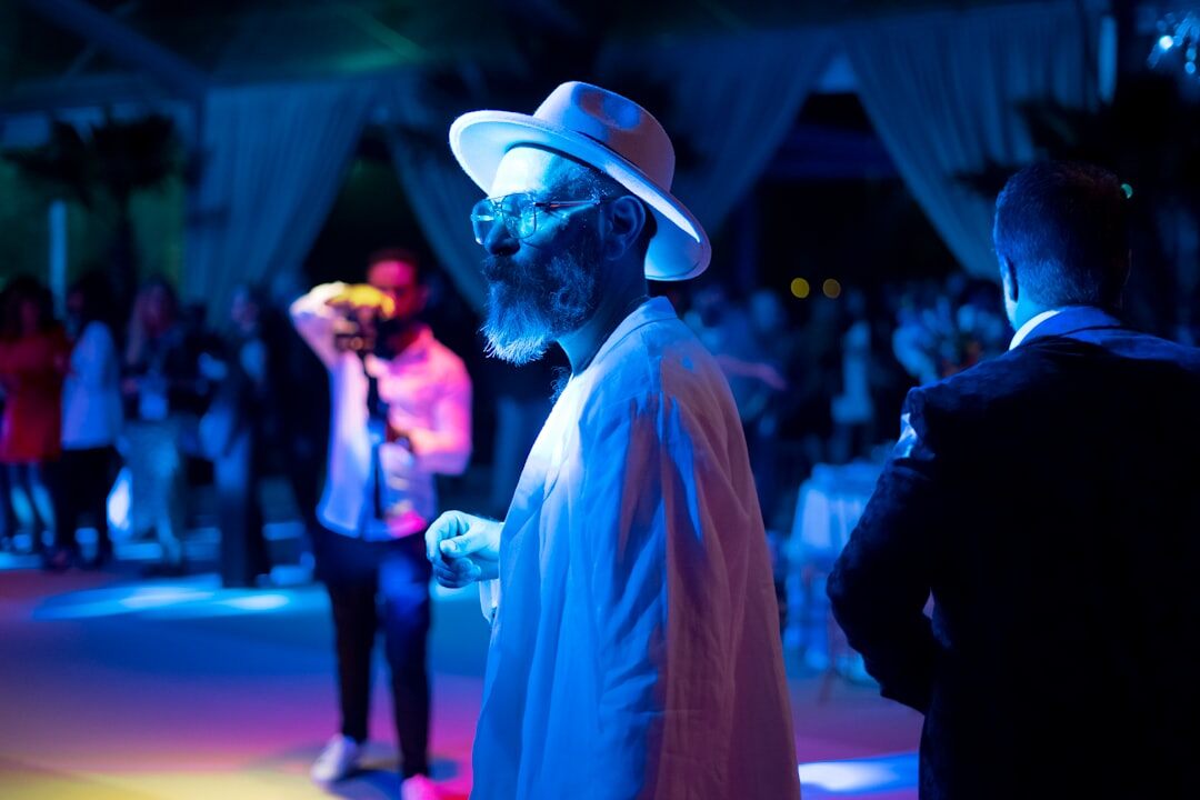 Celebrity performer on stage under colorful lights