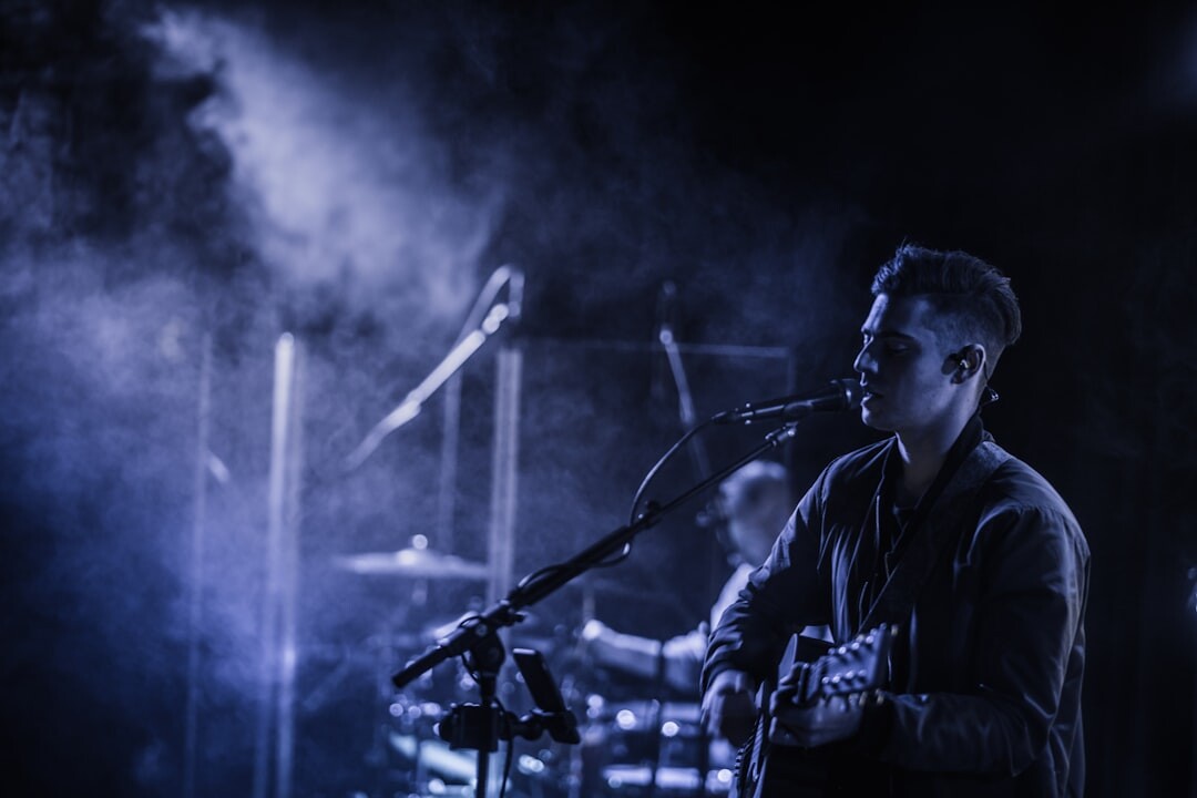 man on stage singing